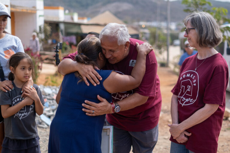 Co-founder & Chairman, Tom Morales comforts the mother of a new home.